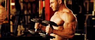 Bare-chested bodybuilder performs hammer curls for biceps