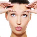 girl stretches her face